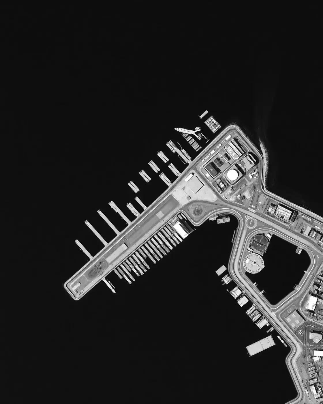 Aerial view of a European coastal port and inland terrain: a shared picture of territory you can act on, not just observe