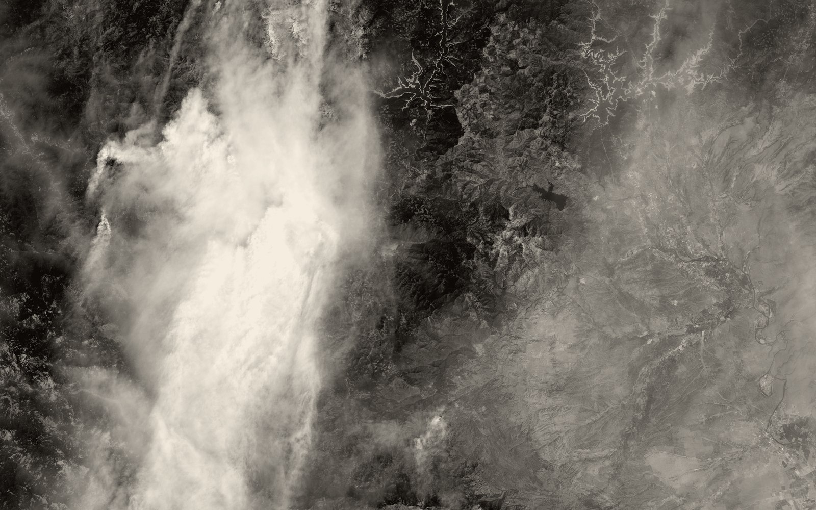Satellite view of wildfire smoke plumes over Northern California terrain, August 2021