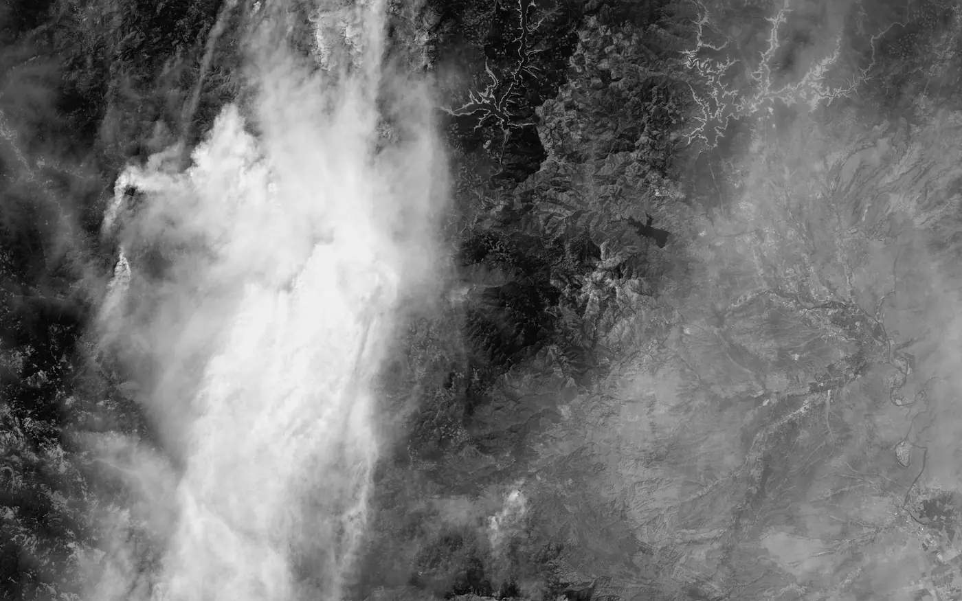 Satellite view of wildfire smoke plumes over Northern California terrain, August 2021